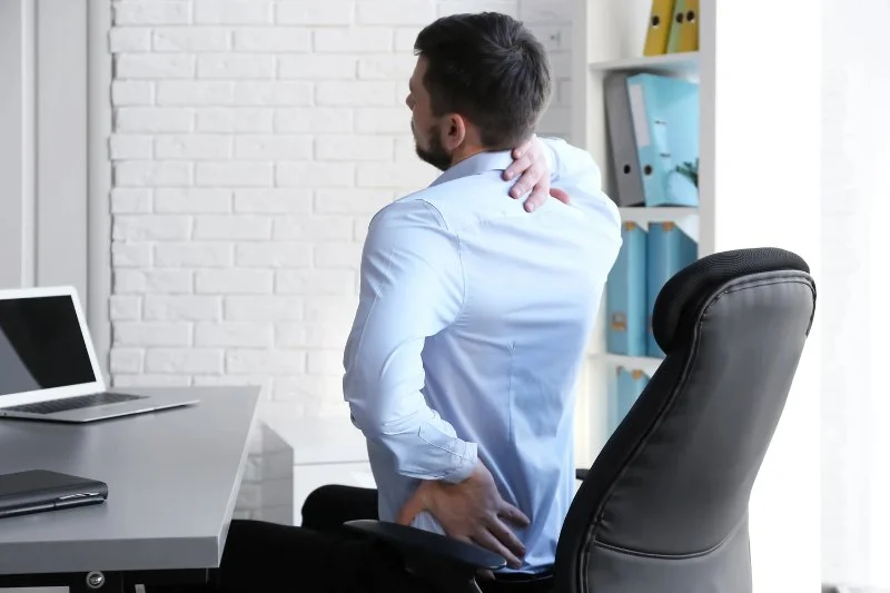 Understanding the Connection Between Desk Job Posture Problems and Your Spine