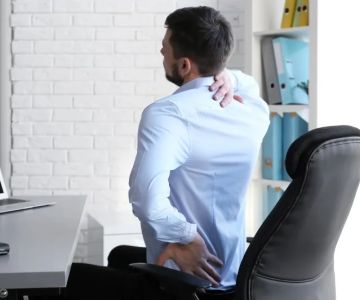 Understanding the Connection Between Desk Job Posture Problems and Your Spine
